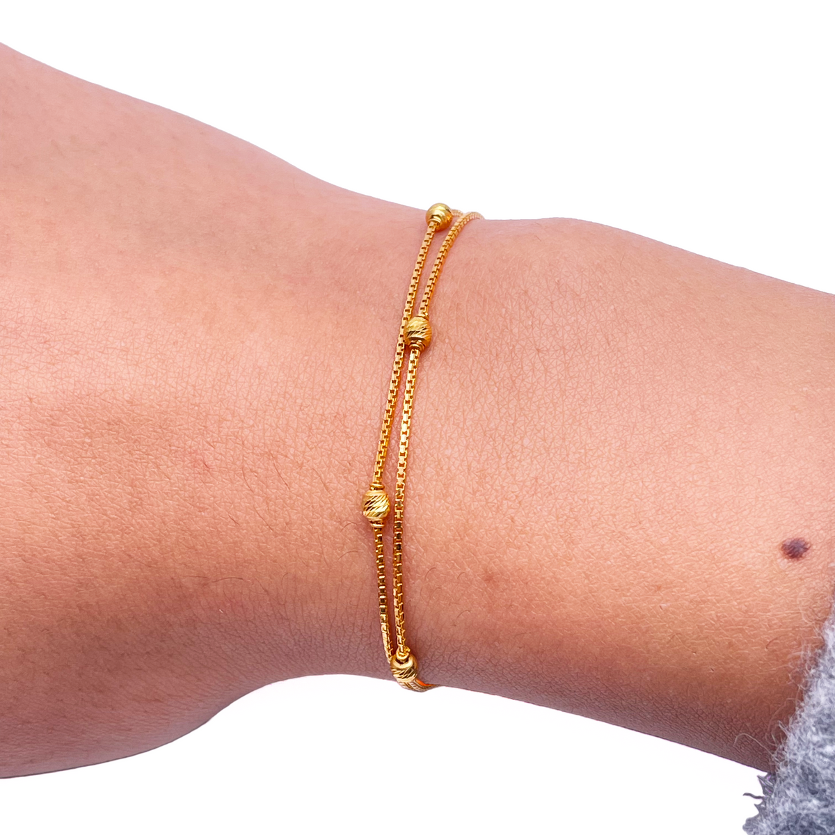 22kt gult guld dobbeltlags kæde med diamant-slebne perler armbånd